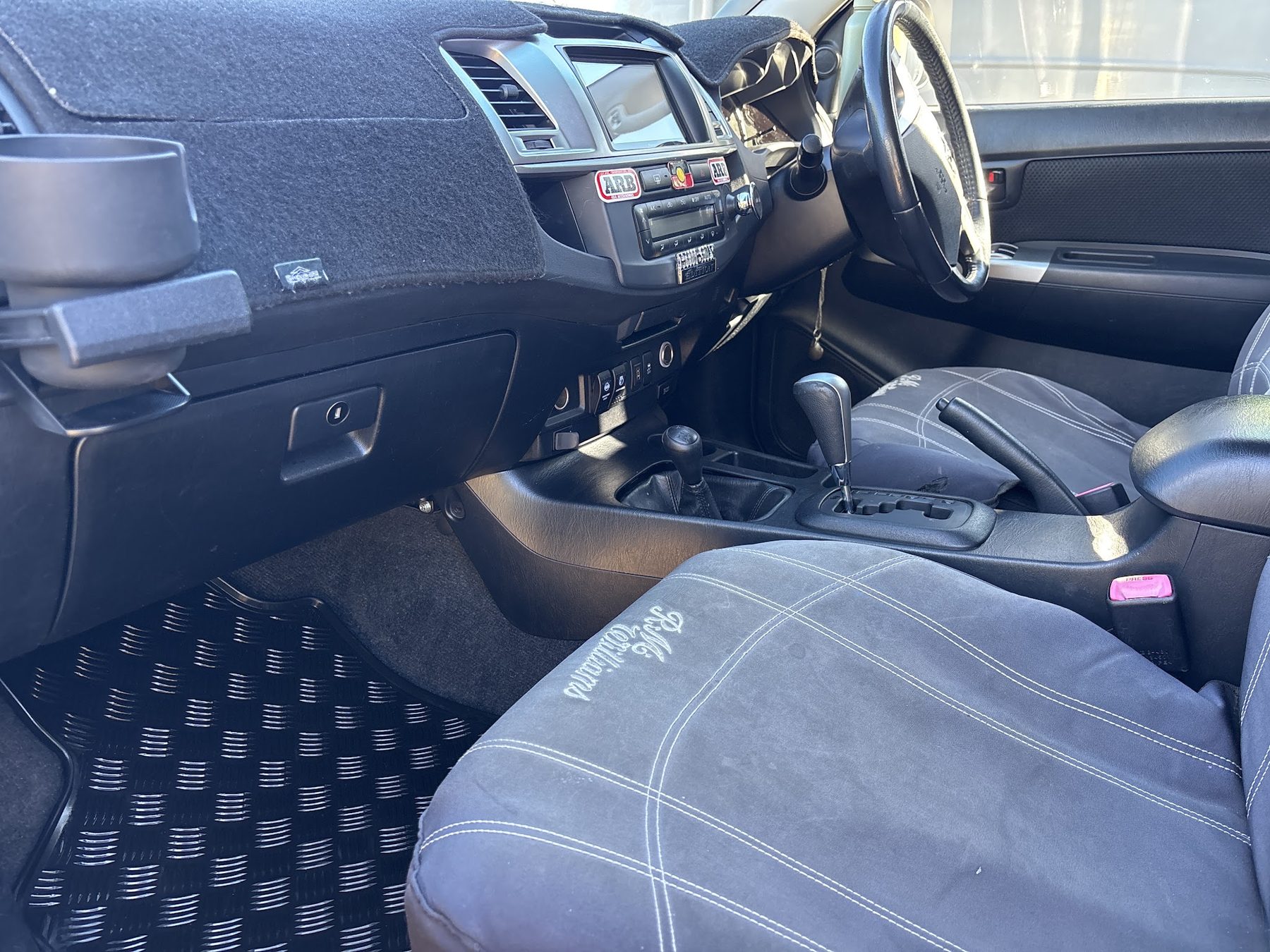 The finished interior of a Toyota HiLux after a full detail, dash and console clean